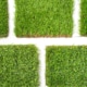 Detail of types of artificial grass in a sample book.